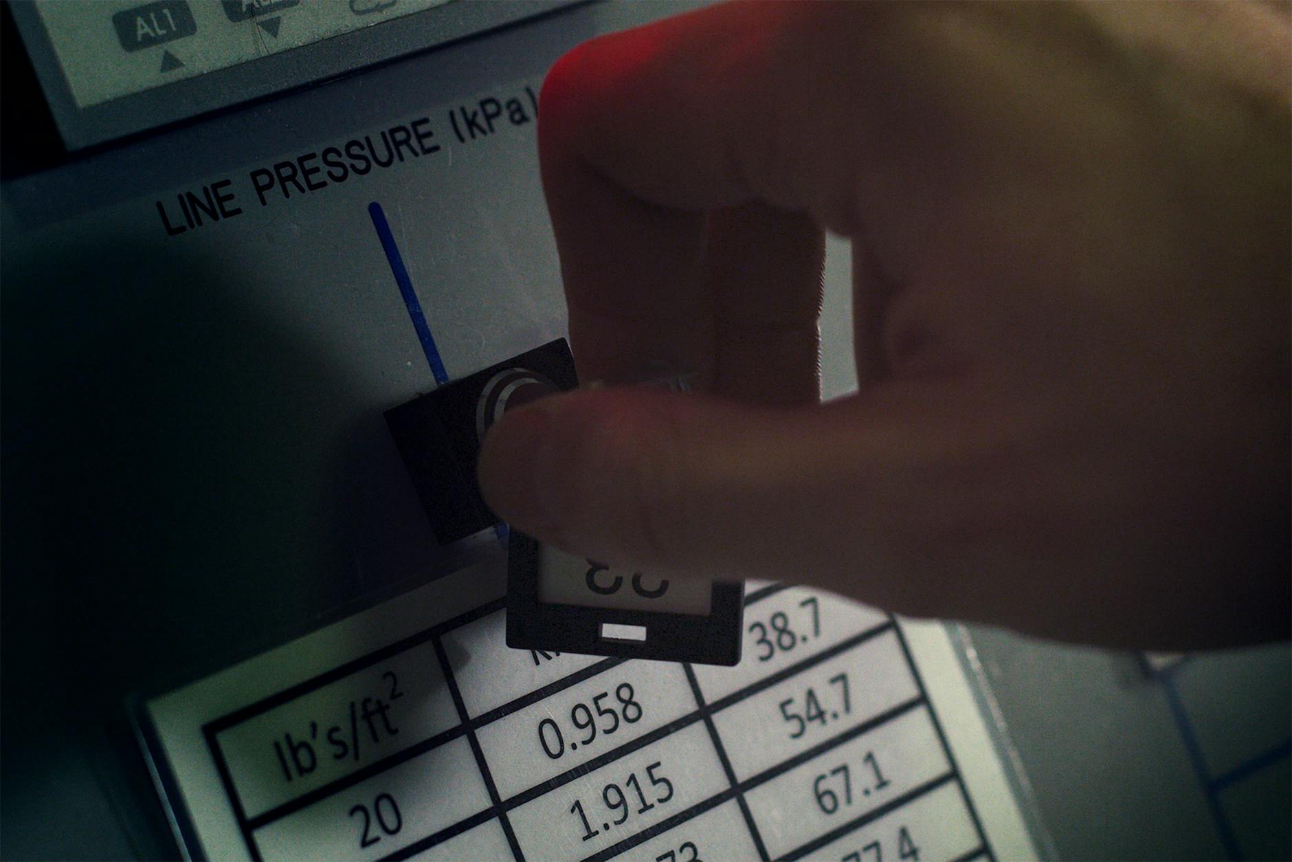 person turning pressure key